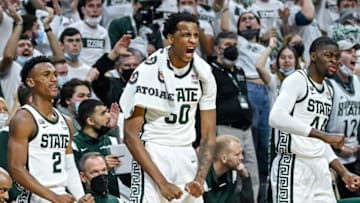 From left, Michigan State's Tyson Walker, Marcus Bingham Jr. and Gabe Brown celebrate after a score against Michigan during the second half on Saturday, Jan. 29, 2022, at the Breslin Center in East Lansing.220129 Msu Mich 202a