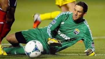 Columbus Crew goalkeeper Andy Gruenebaum dives to force a ball wide during the second half against Chivas USA at the Home Depot Center. Columbus won 3-0. (Christopher Hanewinckel, USA TODAY Sports)