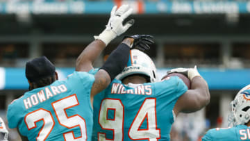 Dec 19, 2021; Miami Gardens, Florida, USA; Miami Dolphins defensive end Christian Wilkins (94) celebrates with cornerback Xavien Howard (25) after scoring a touchdown during the second half against the New York Jets at Hard Rock Stadium. Mandatory Credit: Sam Navarro-USA TODAY Sports