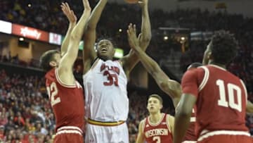 Feb 13, 2016; College Park, MD, USA; Maryland Terrapins center Diamond Stone (33) shoots as Wisconsin Badgers forward Ethan Happ (22) defends during the second half at Xfinity Center. Wisconsin Badgers defeated Maryland Terrapins 70-57. Mandatory Credit: Tommy Gilligan-USA TODAY Sports