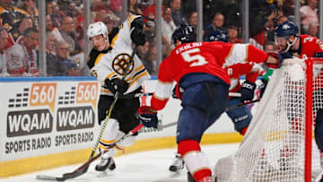 SUNRISE, FL - MARCH 23: Aaron Ekblad #5 of the Florida Panthers defends against Noel Acciari #55 of the Boston Bruins as he circles behind the net with the puck at the BB&T Center on March 23, 2019 in Sunrise, Florida. (Photo by Joel Auerbach/Getty Images)