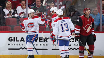 GLENDALE, ARIZONA - OCTOBER 30: Jonathan Drouin #92 of the Montreal Canadiens celebrates with Joel Armia #40 and Max Domi #13 after scoring a goal against the Arizona Coyotes during the third period of the NHL game at Gila River Arena on October 30, 2019 in Glendale, Arizona. The Canadiens defeated the Coyotes 4-1. (Photo by Christian Petersen/Getty Images)