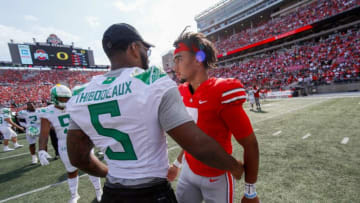 Ohio State Buckeyes quarterback C.J. Stroud (7) hugs Oregon Ducks defensive end Kayvon Thibodeaux (5) following Oregon's 35-28 win over the Buckeyes in the NCAA football game at Ohio Stadium in Columbus on Saturday, Sept. 11, 2021.Oregon Ducks At Ohio State Buckeyes Football