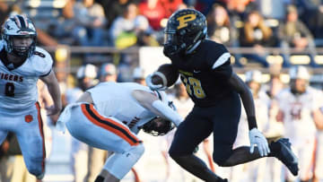 Peabody's Malik Ganaway (18) carries the ball during the second quarter of the Class 2A BlueCross Bowl Football Championship game against Meigs County at Tucker Stadium in Cookeville, Tenn., Saturday, Dec. 5, 2020.Ska4588