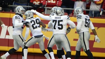 Jan 3, 2016; Kansas City, MO, USA; Oakland Raiders cornerback David Amerson (29) is congratulated after returning an interception for a touchdown against the Kansas City Chiefs in the first half at Arrowhead Stadium. Mandatory Credit: John Rieger-USA TODAY Sports