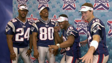 AFC Champions New England Patriots players (L to R) Ty Law, Troy Brown, Lawyer Milloy, and Tom Brady strike a pose for photographers during the team's photo and interview day 29 January 2002 at the Louisiana Superdome in New Orleans. The Patriots will take on the NFC Champions St. Louis Rams in Super Bowl XXXVI on 03 February. AFP PHOTO/Roberto SCHMIDT (Photo by Roberto SCHMIDT / AFP) (Photo credit should read ROBERTO SCHMIDT/AFP via Getty Images)