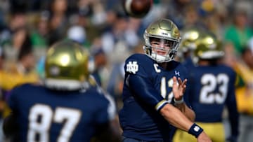 SOUTH BEND, INDIANA - OCTOBER 05: Ian Book #12 of the Notre Dame Fighting Irish warms up before the game against the Bowling Green Falcons at Notre Dame Stadium on October 05, 2019 in South Bend, Indiana. (Photo by Quinn Harris/Getty Images)