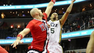 Feb 18, 2016; Washington, DC, USA; Utah Jazz guard Rodney Hood (5) shoots over Washington Wizards center Marcin Gortat (13) during the second half at Verizon Center. The Washington Wizards won 103-89. Mandatory Credit: Brad Mills-USA TODAY Sports