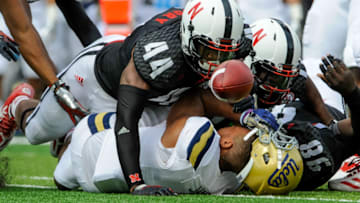 LINCOLN, NE - SEPTEMBER 14: Defensive end Randy Gregory #44 of the Nebraska Cornhuskers and linebacker Zaire Anderson #13 of the Nebraska Cornhuskers scramble for a loose ball knocked away from running back Jordon James #6 of the UCLA Bruins during their game at Memorial Stadium on September 14, 2013 in Lincoln, Nebraska. (Photo by Eric Francis/Getty Images)