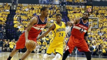 May 5, 2014; Indianapolis, IN, USA; Washington Wizards forward Trevor Ariza (1) drives to the basket against Indiana Pacers forward Paul George (24) in game one of the second round of the 2014 NBA Playoffs at Bankers Life Fieldhouse. Mandatory Credit: Brian Spurlock-USA TODAY Sports