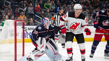 COLUMBUS, OH - SEPTEMBER 27: New Jersey Devils center Blake Coleman #20 and Columbus Blue Jackets goaltender Joonas Korpisalo #70 in game action during the preseason game between the Columbus Blue Jackets and the New Jersey Devils at Nationwide Arena in Columbus, Ohio on September 27, 2019. (Photo by Jason Mowry/Icon Sportswire via Getty Images)