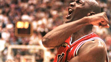 SALT LAKE CITY, UNITED STATES: Michael Jordan of the Chicago Bulls celebrates 14 June after winning game six of the NBA Finals against the Utah Jazz at the Delta Center in Salt Lake City, UT. The Bulls won the game 87-86 to win their sixth NBA Championship. AFP PHOTO/Robert SULLIVAN (Photo credit should read ROBERT SULLIVAN/AFP/Getty Images)