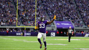 MINNEAPOLIS, MN - DECEMBER 16: Dalvin Cook #33 of the Minnesota Vikings runs with the ball for a 21 yard touchdown, his second of the day, in the fourth quarter of them game against the Miami Dolphins at U.S. Bank Stadium on December 16, 2018 in Minneapolis, Minnesota. (Photo by Adam Bettcher/Getty Images)
