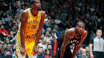 TORONTO, CANADA - NOVEMBER 29: Kevin Durant #35 of the Golden State Warriors and Kawhi Leonard #2 of the Toronto Raptors look on during the game on November 29, 2018 at Scotiabank Arena in Toronto, Ontario, Canada. NOTE TO USER: User expressly acknowledges and agrees that, by downloading and/or using this photograph, user is consenting to the terms and conditions of the Getty Images License Agreement. Mandatory Copyright Notice: Copyright 2018 NBAE (Photo by Mark Blinch/NBAE via Getty Images)