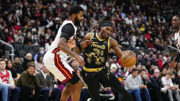 Apr 3, 2022; Toronto, Ontario, CAN; Toronto Raptors forward Precious Achiuwa (5) drives to the net against Miami Heat forward Markieff Morris (8) during the second half at Scotiabank Arena. Mandatory Credit: John E. Sokolowski-USA TODAY Sports