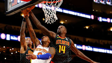 ATLANTA, GEORGIA - FEBRUARY 09: John Collins #20 defends as Dewayne Dedmon #14 of the Atlanta Hawks blocks a shot by Elfrid Payton #6 of the New York Knicks in the first half at State Farm Arena on February 09, 2020 in Atlanta, Georgia. NOTE TO USER: User expressly acknowledges and agrees that, by downloading and/or using this photograph, user is consenting to the terms and conditions of the Getty Images License Agreement. (Photo by Kevin C. Cox/Getty Images)