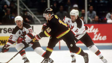 EAST RUTHERFORD, NJ - CIRCA 1993: Pavel Bure #10 of the Vancouver Canucks skates against the New Jersey Devils during an NHL Hockey game circa 1993 at the Brendan Byrne Arena in East Rutherford, New Jersey. Bure playing career went from 1987-2003. (Photo by Focus on Sport/Getty Images)