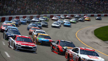 RICHMOND, VA - APRIL 30: Matt Kenseth, driver of the #20 Circle K Toyota, and Ryan Blaney, driver of the #21 Motorcraft/Quick Lane Tire & Auto Center Ford, lead the field into turn one to start the Monster Energy NASCAR Cup Series Toyota Owners 400 at Richmond International Raceway on April 30, 2017 in Richmond, Virginia. (Photo by Sarah Crabill/Getty Images)