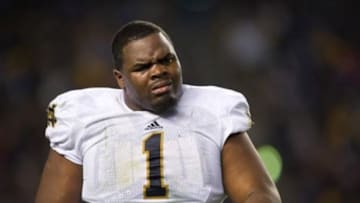 Nov 9, 2013; Pittsburgh, PA, USA; Notre Dame Fighting Irish nose tackle Louis Nix (1) walks to the sideline in the third quarter against the Pittsburgh Panthers at Heinz Field. Pitt won 28-21. Mandatory Credit: Matt Cashore-USA TODAY Sports