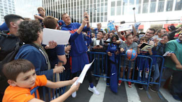 NEW YORK, NY - SEPTEMBER 29: Kristaps Porzingis #6 of the New York Knicks snaps a selfie with a fan during their Open Practice on September 29, 2018 at Madison Square Garden in New York City, New York. NOTE TO USER: User expressly acknowledges and agrees that, by downloading and or using this photograph, User is consenting to the terms and conditions of the Getty Images License Agreement. Mandatory Copyright Notice: Copyright 2018 NBAE (Photo by Nathaniel S. Butler/NBAE via Getty Images)