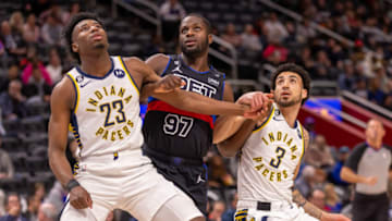 Indiana Pacers forward Aaron Nesmith (23) and guard Chris Duarte (3) block out Detroit Pistons forward Eugene Omoruyi Credit: David Reginek-USA TODAY Sports