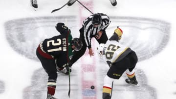Derek Stepan #21 of the Arizona Coyotes and Tomas Nosek #92 of the Vegas Golden Knights face off in the second period during an exhibition game. (Photo by Jeff Vinnick/Getty Images)
