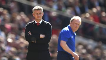 MANCHESTER, ENGLAND - MAY 12: United manager Ole Gunnar Solskjaer (l) reacts on the touchline as Cardiff manager Neil Warnock looks on during the Premier League match between Manchester United and Cardiff City at Old Trafford on May 12, 2019 in Manchester, United Kingdom. (Photo by Stu Forster/Getty Images)