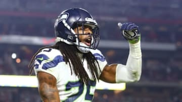Dec 21, 2014; Glendale, AZ, USA; Seattle Seahawks cornerback Richard Sherman (25) celebrates his fourth quarter interception against the Arizona Cardinals at University of Phoenix Stadium. The Seahawks defeated the Cardinals 35-6. Mandatory Credit: Mark J. Rebilas-USA TODAY Sports