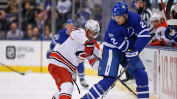 TORONTO, ON - OCTOBER 26: Toronto Maple Leafs defenseman Ron Hainsey (2) with a nifty backhand pass in front of Carolina Hurricanes right wing Sebastian Aho (20). Toronto Maple Leafs VS Carolina Panthers during 1st period action in NHL regular season play at the Air Canada Centre. Toronto Star/Rick Madonik (Rick Madonik/Toronto Star via Getty Images)