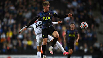 MILTON KEYNES, ENGLAND - JULY 28: Jack Clarke of Tottenham Hotspur is challenged by Josh Martin of Milton Keynes Dons during the Pre-Season Friendly match between Milton Keynes Dons and Tottenham Hotspur at Stadium mk on July 28, 2021 in Milton Keynes, England. (Photo by Shaun Botterill/Getty Images)