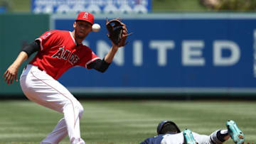 ANAHEIM, CA - JULY 29: Andrelton Simmons #2 of the Los Angeles Angels of Anaheim waits for the throw as Dee Gordon #9 of the Seattle Mariners slides safely into second base on the steal in the first inning during the MLB game at Angel Stadium on July 29, 2018 in Anaheim, California. (Photo by Victor Decolongon/Getty Images)