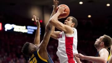 Mar 3, 2016; Tucson, AZ, USA; Arizona Wildcats forward Ryan Anderson (12) shoots the ball as California Golden Bears center Kingsley Okoroh (22) defends during the first half at McKale Center. Mandatory Credit: Casey Sapio-USA TODAY Sports