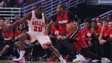Jan 25, 2016; Chicago, IL, USA; Miami Heat guard Dwyane Wade (3) is defended by Chicago Bulls forward Tony Snell (20) during the first quarter at the United Center. Mandatory Credit: Dennis Wierzbicki-USA TODAY Sports