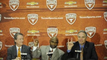 Jan 6, 2014; Austin, TX, USA; Texas Longhorns president Bill Powers (left) and head football coach Charlie Strong (center) and athletics director Steve Patterson (right) speak at a press conference in the Centennial Room of Belmont Hall at Texas-Memorial Stadium. Mandatory Credit: Brendan Maloney-USA TODAY Sports