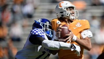 Tennessee quarterback Jarrett Guarantano is sacked by Kentucky linebacker Jordan Wright