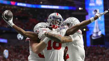 ATLANTA, GEORGIA - DECEMBER 31: Marvin Harrison Jr. #18 of the Ohio State Buckeyes celebrates after a touchdown during the second quarter in the Chick-fil-A Peach Bowl at Mercedes-Benz Stadium on December 31, 2022 in Atlanta, Georgia. (Photo by Carmen Mandato/Getty Images)