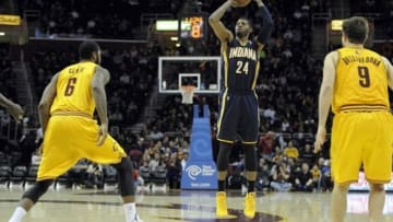 Jan 5, 2014; Cleveland, OH, USA; Indiana Pacers small forward Paul George (24) shoots in the third quarter against the Cleveland Cavaliers at Quicken Loans Arena. Mandatory Credit: David Richard-USA TODAY Sports