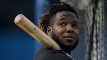TORONTO, ON - SEPTEMBER 17: Vladimir Guerrero Jr. #27 of the Toronto Blue Jays warms up prior to their MLB game against the Minnesota Twins at Rogers Centre on September 17, 2021 in Toronto, Ontario. (Photo by Cole Burston/Getty Images)