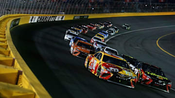 CHARLOTTE, NC - MAY 19: Kyle Busch, driver of the #18 M and M's Red Nose Day Toyota, and Martin Truex Jr., driver of the #78 5-hour Energy/Bass Pro Shops Toyota (Photo by Sean Gardner/Getty Images)