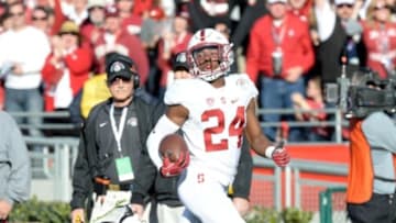 Jan 1, 2016; Pasadena, CA, USA; Stanford Cardinal cornerback Quenton Meeks (24) returns an interception for a touchdown against the Iowa Hawkeyes during the first quarter in the 2016 Rose Bowl at Rose Bowl. Mandatory Credit: Richard Mackson-USA TODAY Sports