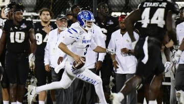ORLANDO, FLORIDA - DECEMBER 01: Brady White #3 of the Memphis Tigers runs for a first down in the fourth quarter of the American Athletic Championship against the UCF Knights at Spectrum Stadium on December 01, 2018 in Orlando, Florida. (Photo by Julio Aguilar/Getty Images)