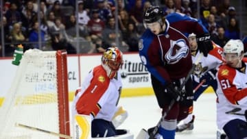 Oct 21, 2014; Denver, CO, USA; Colorado Avalanche center Nathan MacKinnon (29) shoots on Florida Panthers goalie Roberto Luongo (1) in the second period at Pepsi Center. Mandatory Credit: Ron Chenoy-USA TODAY Sports