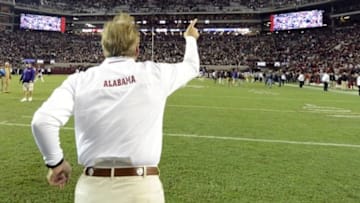 Nov 9, 2013; Tuscaloosa, AL, USA; Alabama Crimson Tide head coach Nick Saban celebrates as he leaves the field following their 38-17 victory over the LSU Tigers at Bryant-Denny Stadium. Mandatory Credit: John David Mercer-USA TODAY Sports