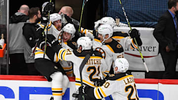 May 17, 2021; Washington, District of Columbia, USA; Boston Bruins center Brad Marchand (left) reacts after scoring the winning goal against the Washington Capitals during the first overtime period in game two of the first round of the 2021 Stanley Cup Playoffs at Capital One Arena. Mandatory Credit: Brad Mills-USA TODAY Sports