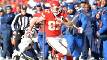 Dec 28, 2014; Kansas City, MO, USA; Kansas City Chiefs tight end Travis Kelce (87) runs the ball as San Diego Chargers defensive back Jahleel Addae (37) attempts the tackle during the first half at Arrowhead Stadium. The Chiefs won 19-7. Mandatory Credit: Denny Medley-USA TODAY Sports