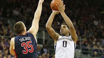 Feb 6, 2016; Seattle, WA, USA; Washington Huskies forward Marquese Chriss (0) shoots over Arizona Wildcats center Kaleb Tarczewski (35) during the second half at Alaska Airlines Arena. Arizona won 77-72. Mandatory Credit: Jennifer Buchanan-USA TODAY Sports