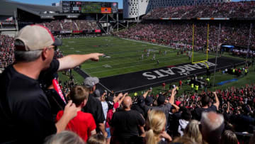 Bearcats fans cheer on a defensive stop late in the second quarter of the NCAA Big 12 football game between the Cincinnati Bearcats and the Oklahoma Sooners at Nippert Stadium in Cincinnati on Saturday, Sept. 23, 2023.