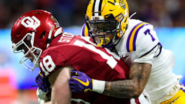 ATLANTA, GA - DECEMBER 28: Austin Stogner #18 of the Oklahoma Sooners rushes under pressure from defender Grant Delpit #7 of the LSU Tigers during the Chick-fil-A Peach Bowl at Mercedes-Benz Stadium on December 28, 2019 in Atlanta, Georgia. (Photo by Carmen Mandato/Getty Images)