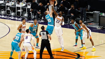 PHOENIX, ARIZONA - FEBRUARY 24: Deandre Ayton #22 of the Phoenix Suns and Cody Zeller #40 of the Charlotte Hornets jump for the opening tip during the first half of the NBA game at Phoenix Suns Arena on February 24, 2021 in Phoenix, Arizona. NOTE TO USER: User expressly acknowledges and agrees that, by downloading and or using this photograph, User is consenting to the terms and conditions of the Getty Images License Agreement. (Photo by Christian Petersen/Getty Images)