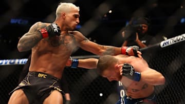 May 7, 2022; Phoenix, Arizona, USA; Charles Oliveira moves in for a hit against Justin Gaethje during UFC 274 at Footprint Center. Mandatory Credit: Mark J. Rebilas-USA TODAY Sports